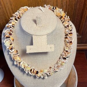 Shell Chocker Necklace with Brown and Cream Tones.  Barrel screw closure 16”